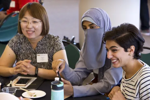 Three women smiling