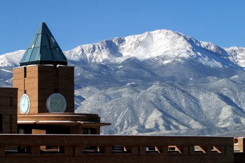 Clocktower with pikes peak in the background