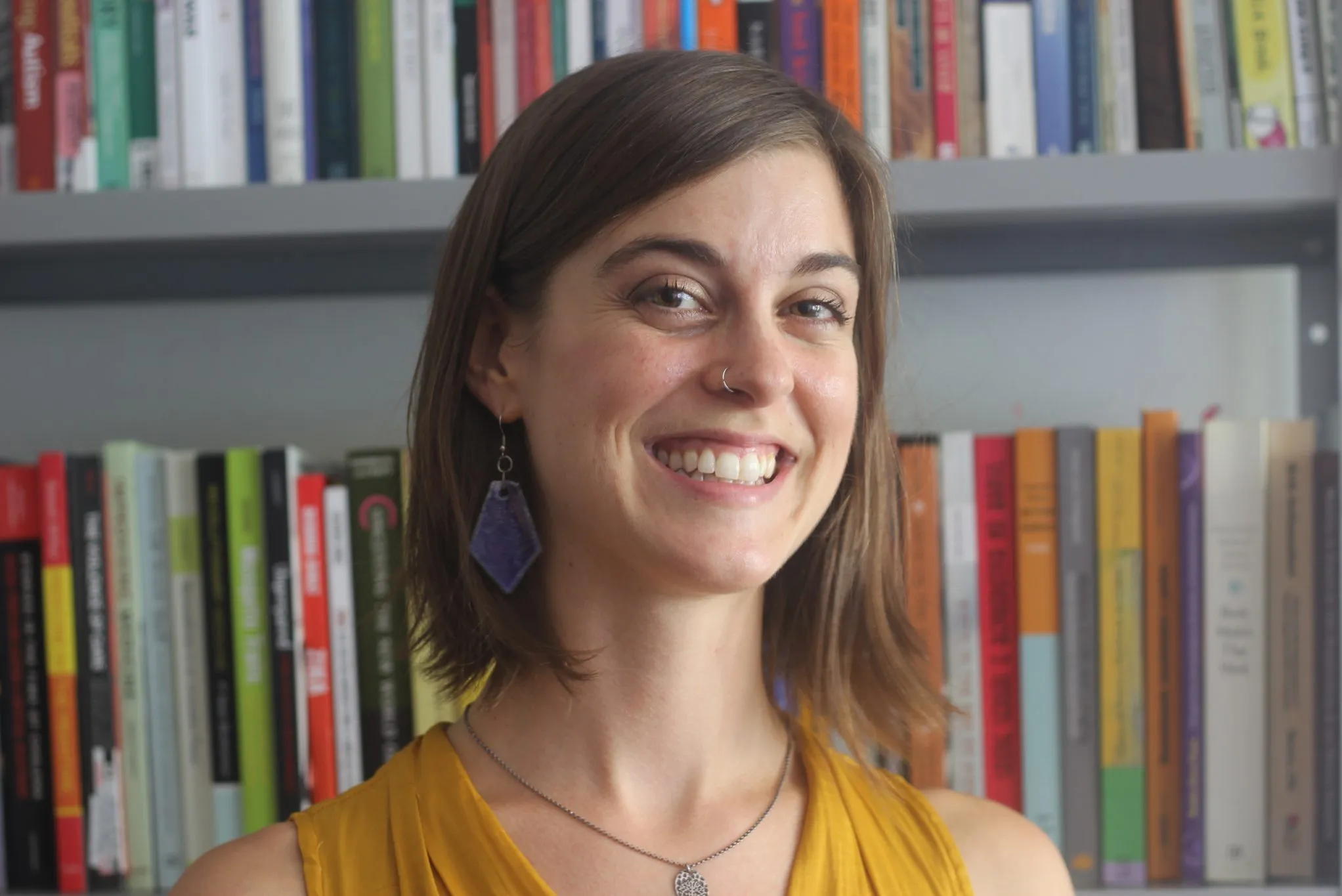 Headshot of Dr. Williamson in front of a bookshelf